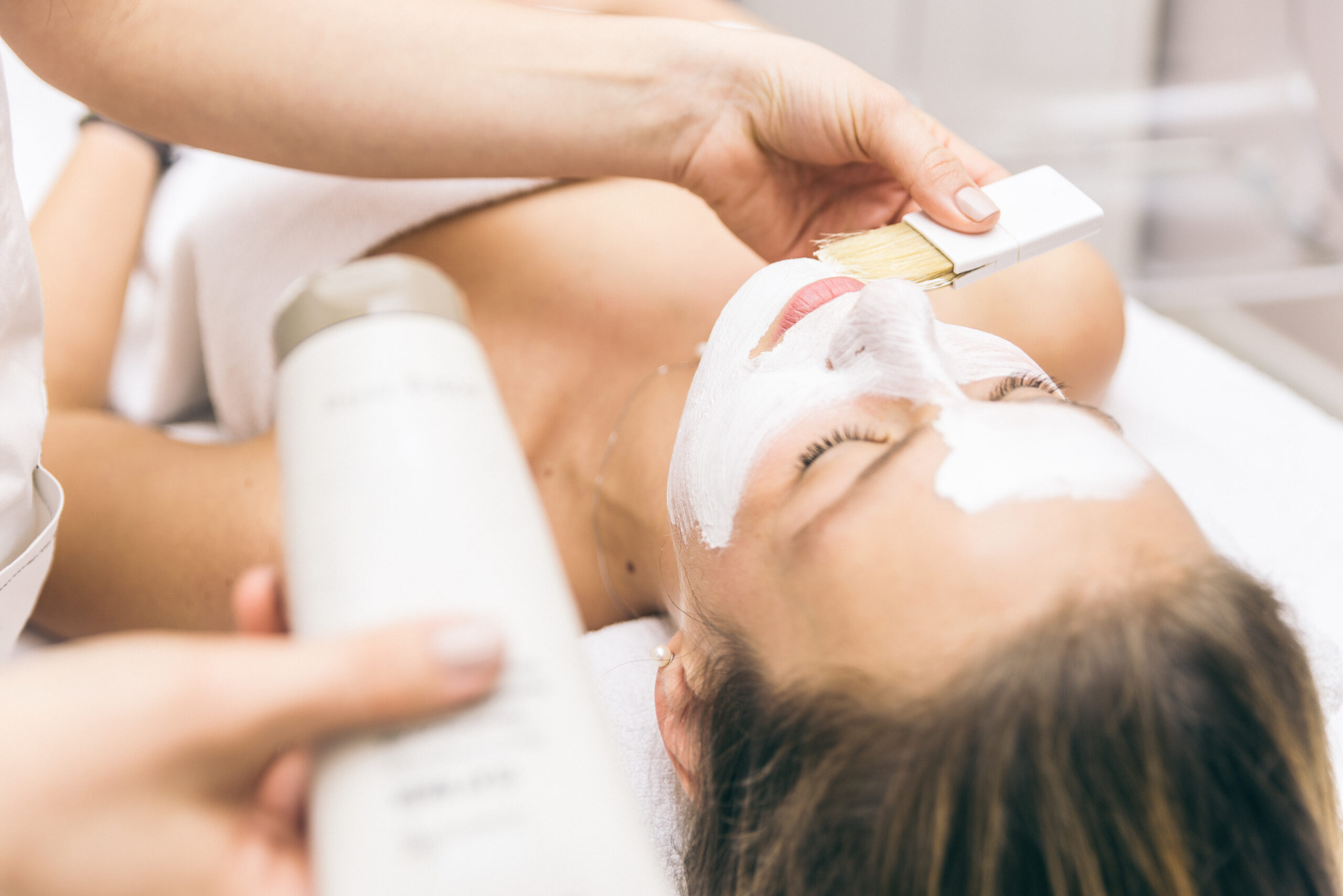 woman making facial treatment in a beauty saloon
